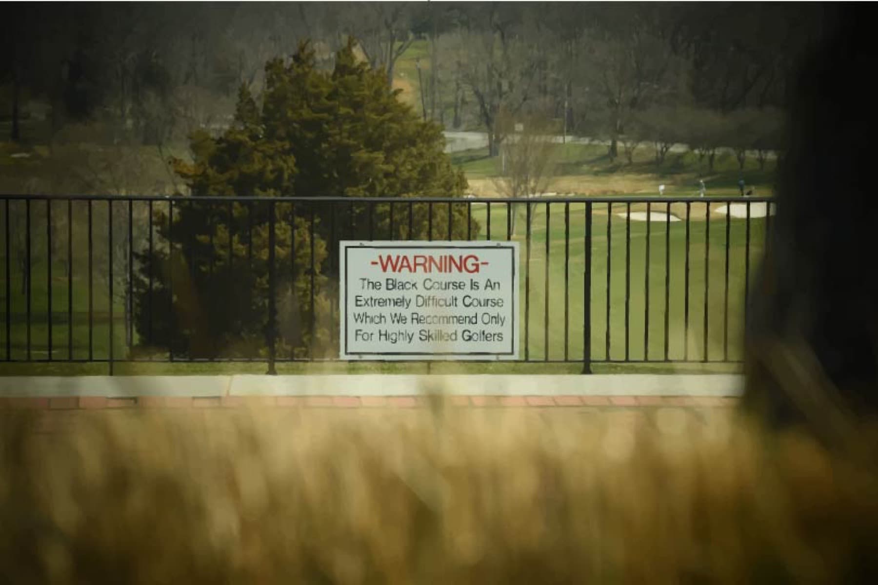 The famous warning sign at Bethpage Black's first tee