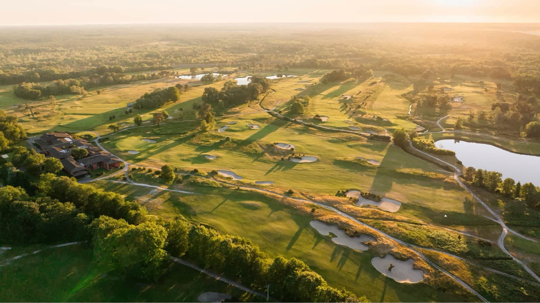 Sunrise over Châteaux's clubhouse and first fairway