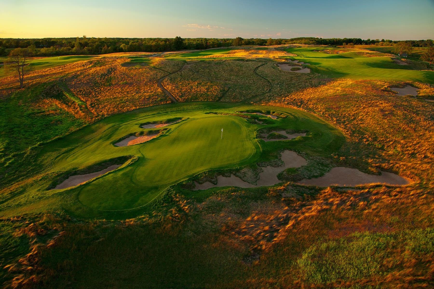 Sunset over Erin Hills' fescue and glacial terrain