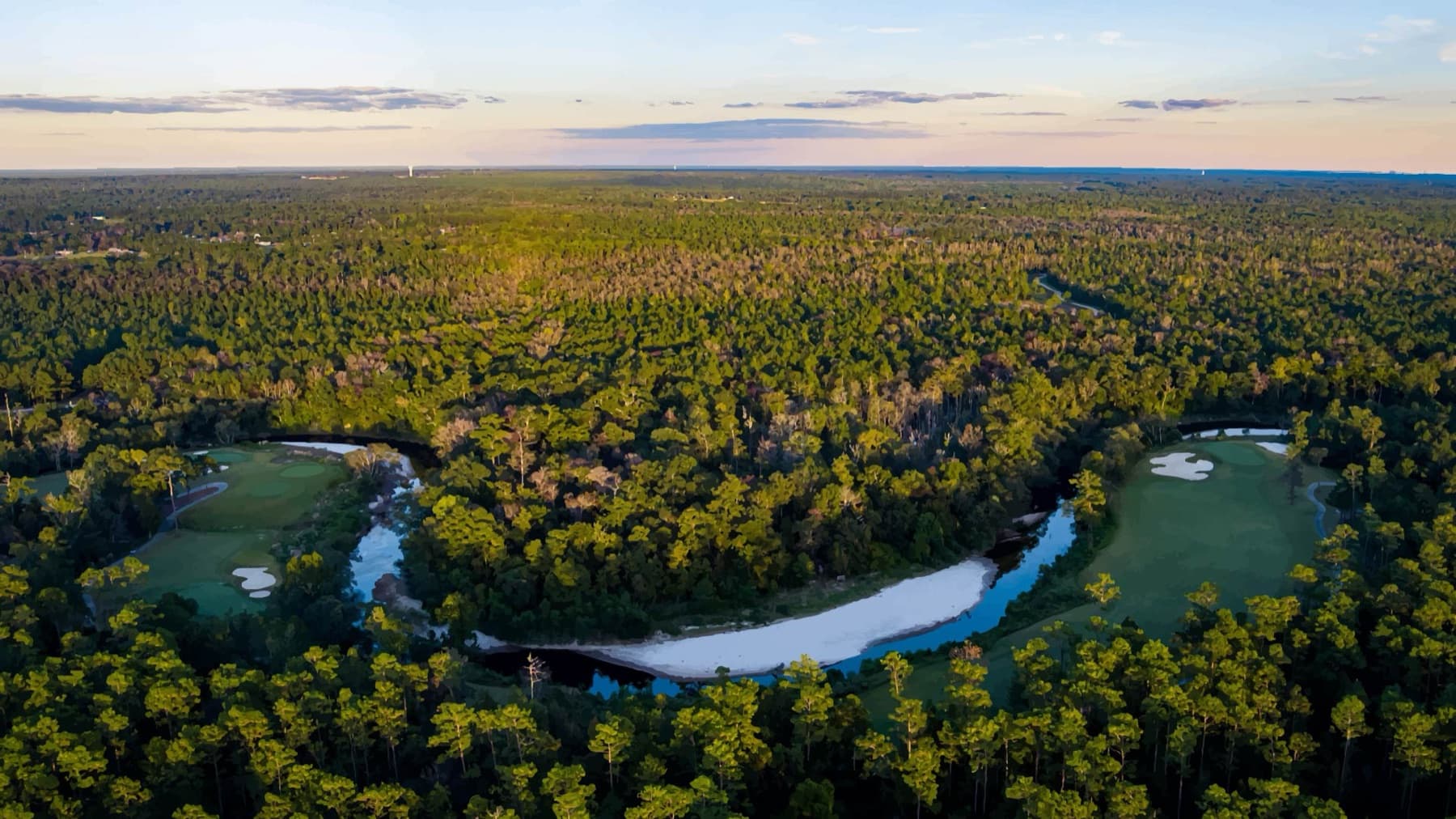 two greens across the river bend
