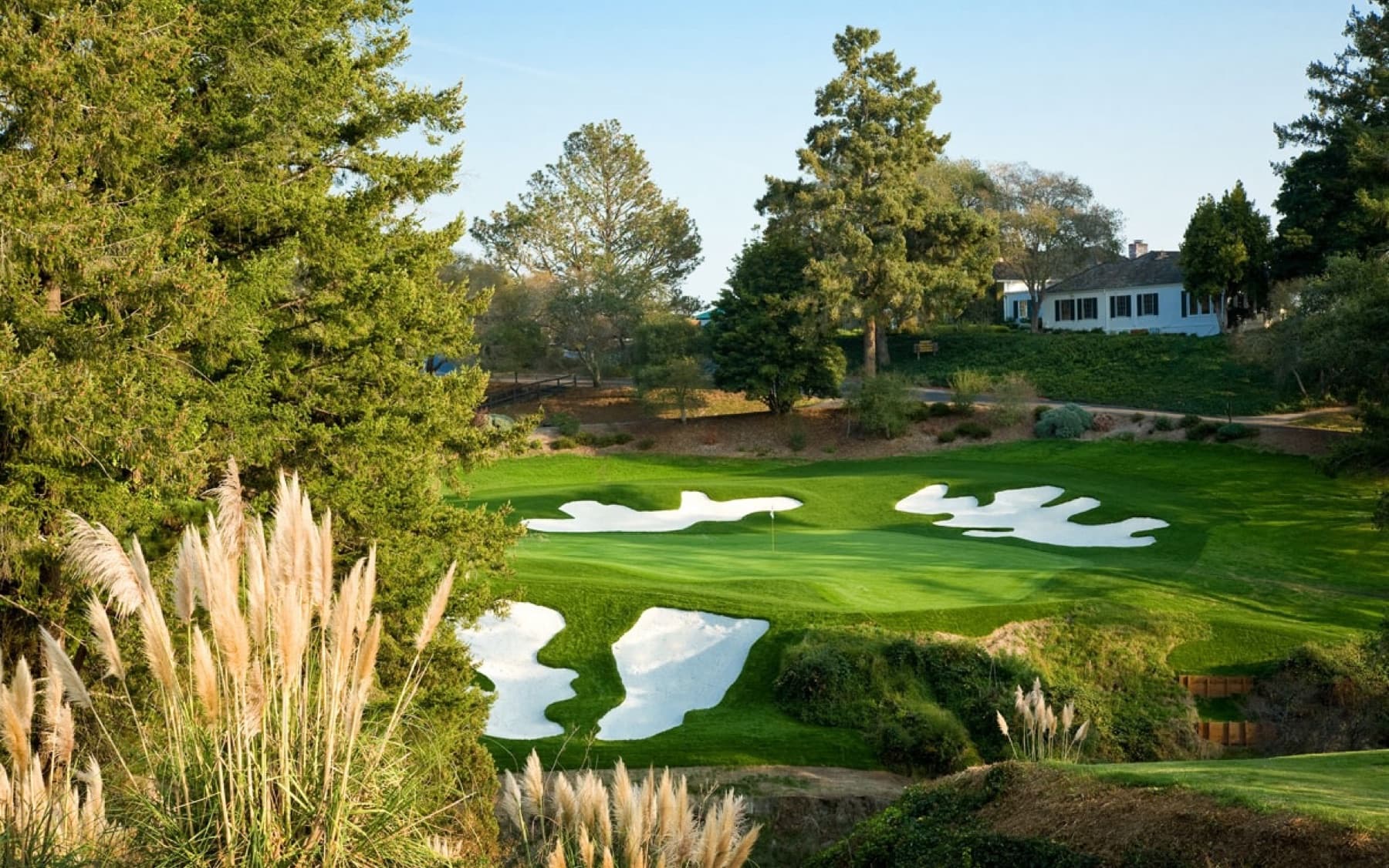 the par-3 18th's restored barranca bunkering below the clubhouse