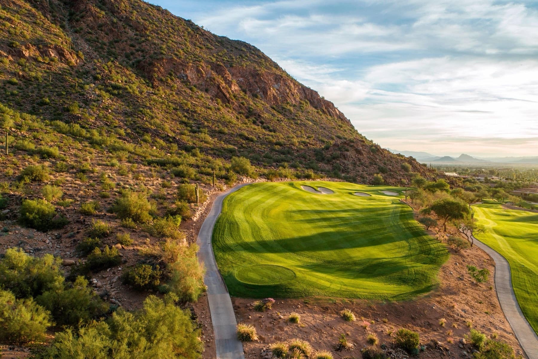 a green tucked against the Camelback mountainside
