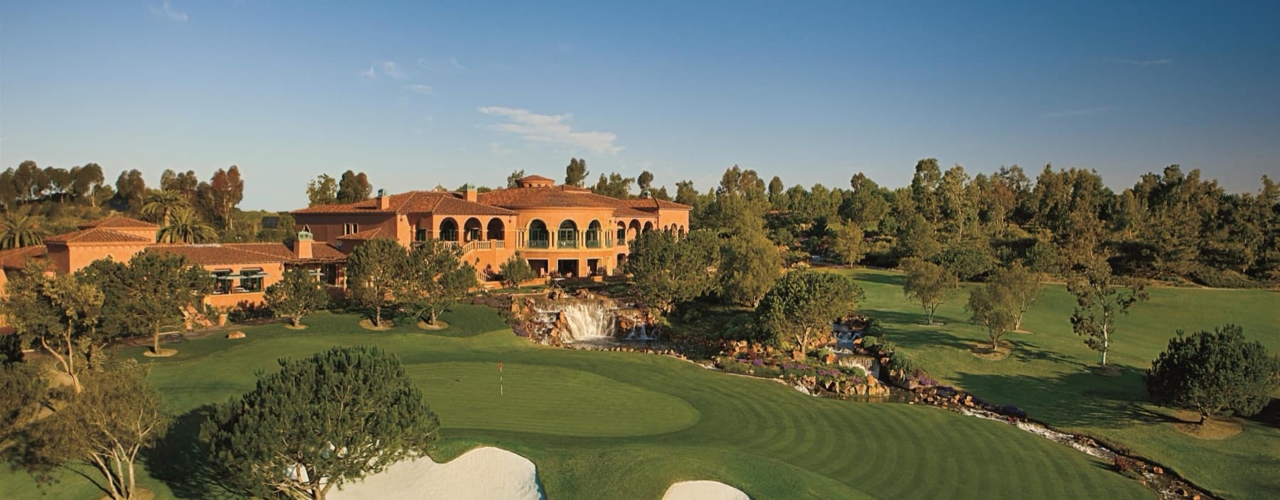 the Grand Del Mar clubhouse and the waterfall behind the 18th green, from the air