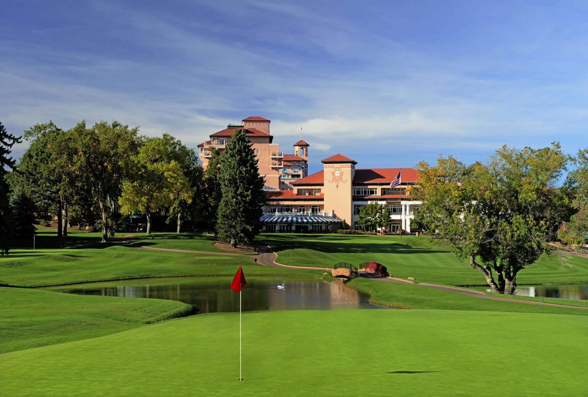 the pink Mediterranean hotel above the East Course pond