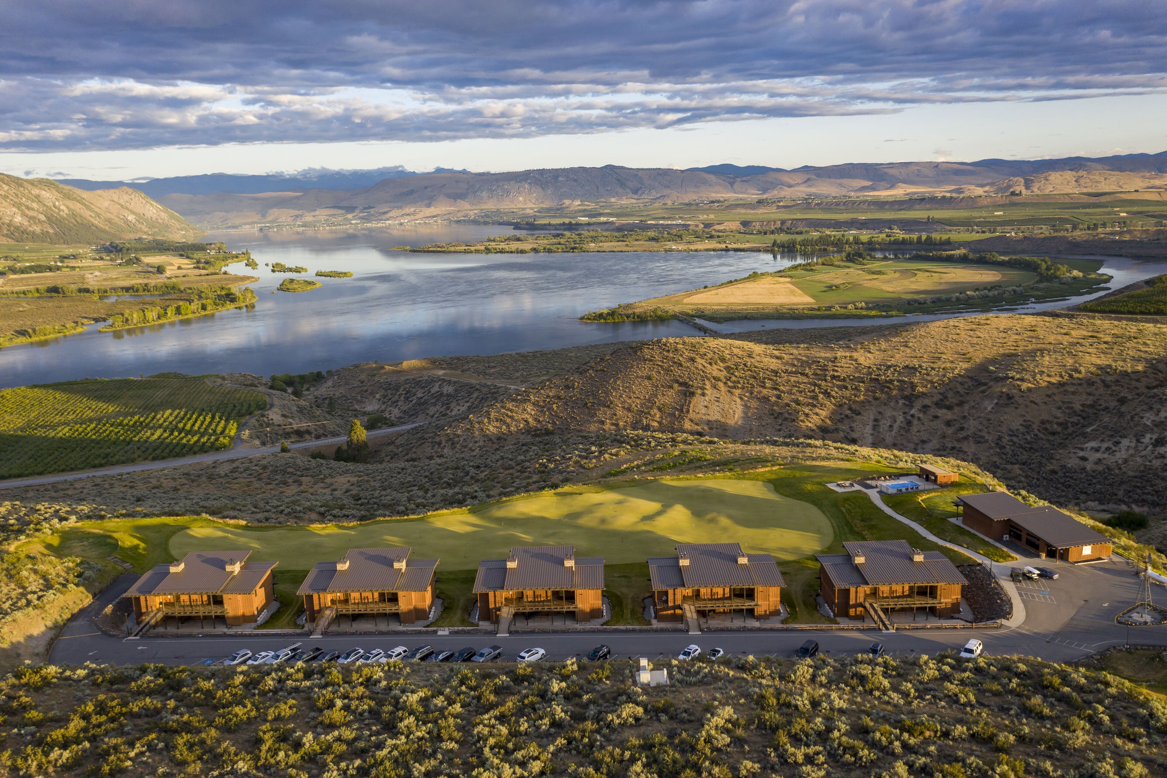 the resort cottages and practice green above the Columbia
